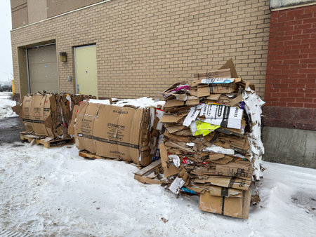 A pile of cardboard boxes outside in winter.のeditorial素材