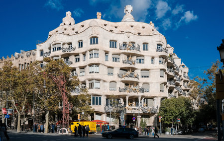 Tourists visiting Las Ramblas in Barcelona, Spain. Casa MilÃ , better known as La Pedrera.