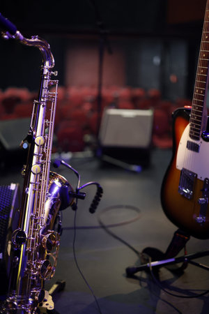 Guitar on stage in concert hall, closeup of photo