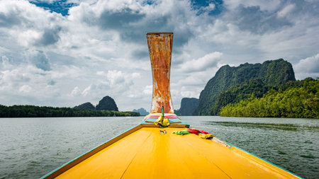 Traditional Thai long tail boat on a bay, Thailand, view from the boat