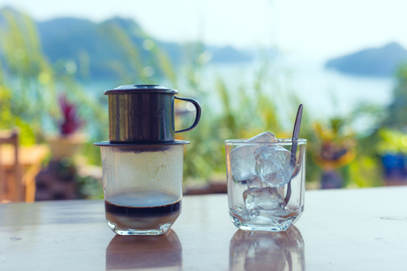 traditional Vietnamese coffee with landscape in backgroundの写真素材