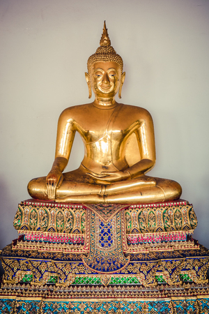 golden buddha statue in ( Wat Pho ) temple of Bangkok in Thailandの写真素材
