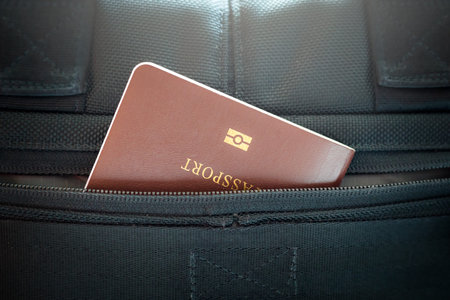 passport inside black luggage pocket .
