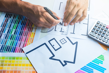 Business, architecture, building, construction and people concept - close up of architect working on blueprint .の写真素材