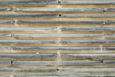 Old gray brick wall texture backgroundの写真素材