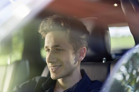 Close up of a young happy driver.の写真素材