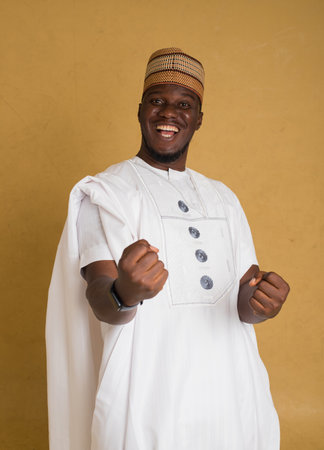 A Babariga Traditionally Dressed Arewa Northern Business Man Winning in a Business Dealの写真素材