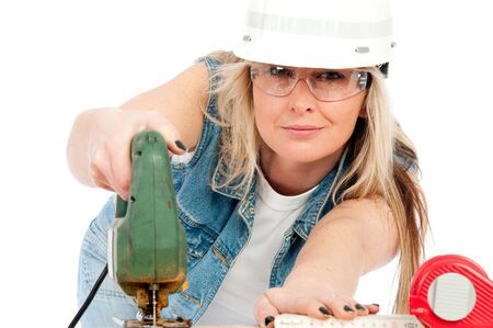 Young blonde woman is working with Jigsawの写真素材