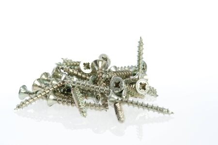 Close-up of screws on a white backgroundの写真素材