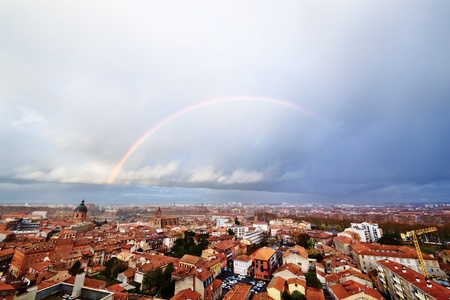 Panoramic view on a rainbow above Saint Syprien district in Toulouse, Franceの写真素材