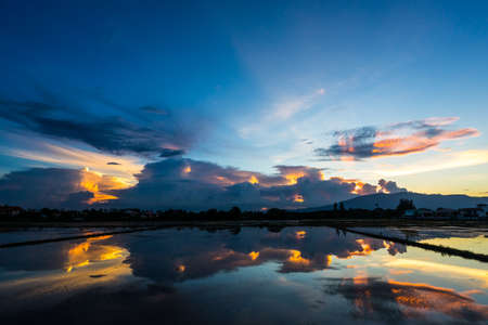 The sky is colorful with clouds at sunset.の写真素材