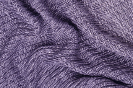 close up purple knitted pullover background