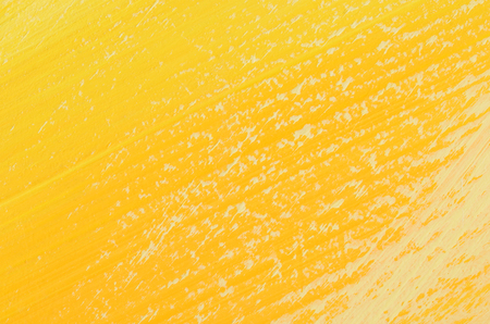 close up painted in shades of yellow wallの写真素材