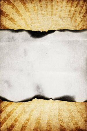 Vintage burned paper on sunburst background.の写真素材