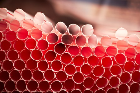 White straws with red line (for cocktail). Shot from top viewpoint, shallow DOF.の写真素材