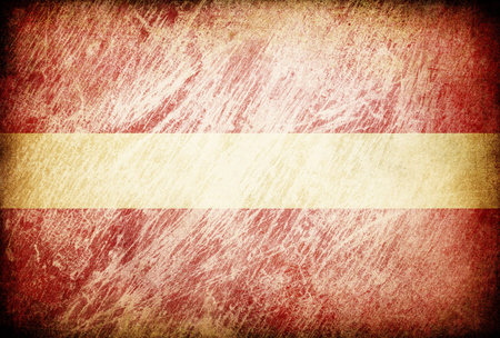 Grunge rubbed flag series of backgrounds. Latvia.の写真素材