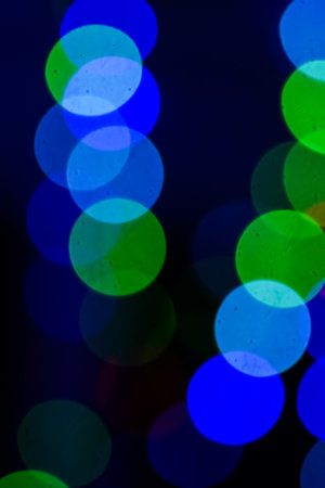 Color bokeh from an old vintage lens on a dark background