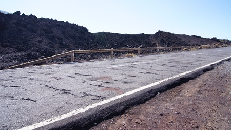 Old road in Teide national park with black clinker, Tenerife, Spainの写真素材