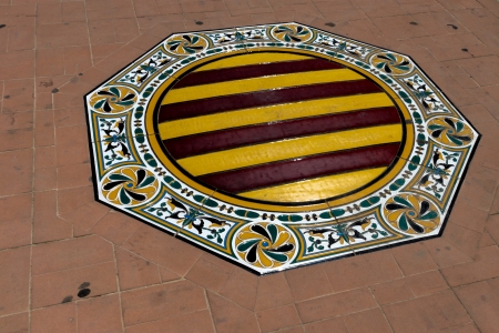 Spanish flag in the form of a tile on the Plaza de Espana in Sevilla, Spainの写真素材
