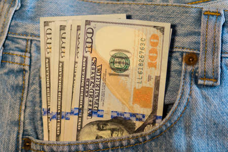 American dollar bills in jeans pocket backgroundの写真素材