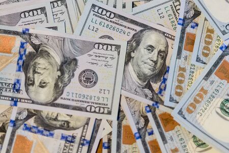 Lots of hundred-dollar bills background. The new sample.の写真素材