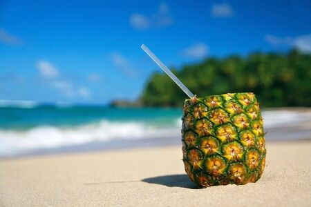 Pina colada on beach of Atlantic oceanの写真素材