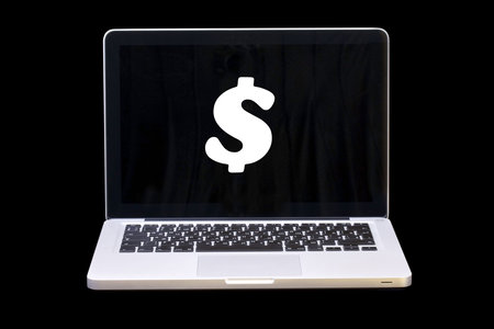 Laptop with sign Dollar on screenの写真素材