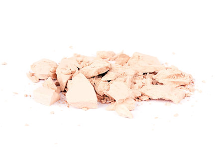 Crumbled eyeshadows isolated on white, closed-up