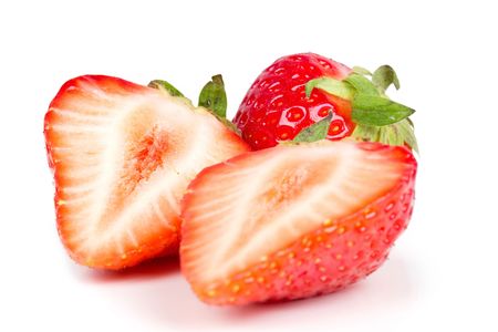 Half of strawberry isolated on white,closed-up の写真素材