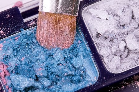 Professional brush on blue eye shadows palette, closed-upの写真素材