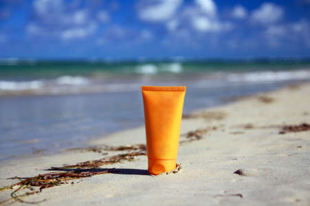 Tube with sun protection on beach of ocean の写真素材