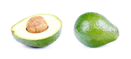 Whole and cutted avocado isolated on white の写真素材