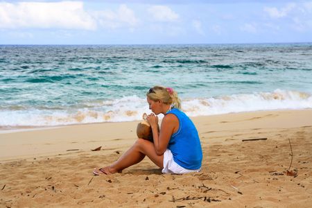 Girl on a beach with coconutの写真素材