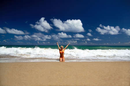 Happy girl on a beach of Atlantic Oceanの写真素材