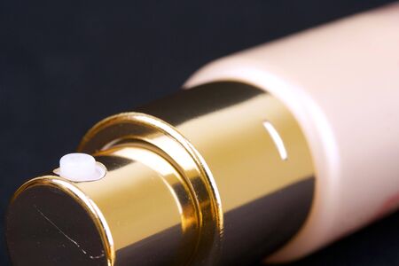 Measuring spray tube on black の写真素材