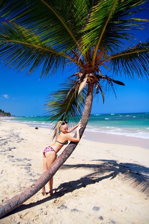 Girl in bikini relaxing near a palm, Dominican Republic の写真素材