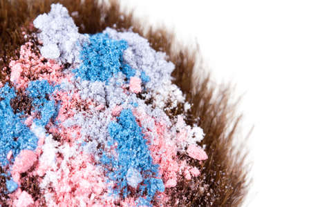 Eyeshadows on professional make-up brush, macro on whiteの写真素材