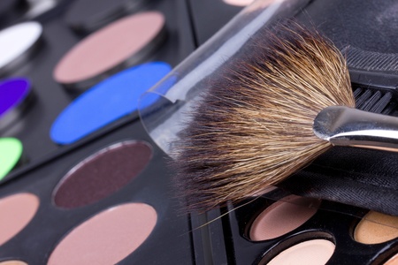 Professional make-up brush and eyeshadows palettes, closed-upの写真素材