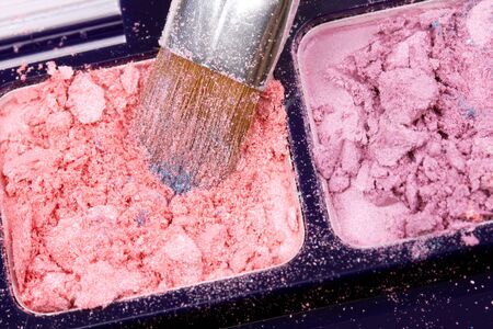 Professional brush in orange eyeshadows palette, closed-upの写真素材