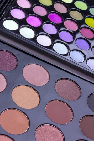 Neutral and multicolour eyeshadows palettes, closed-upの写真素材