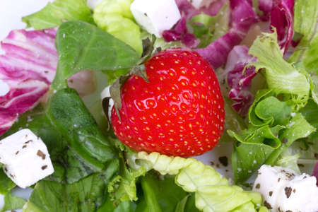 Strawberry in fresh salad, closed-upの写真素材