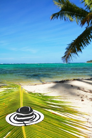 Beach woman hat on palm leaf on caribbean seaの写真素材