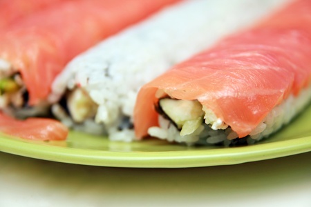Ready sushi roll on green plate, closeupの写真素材