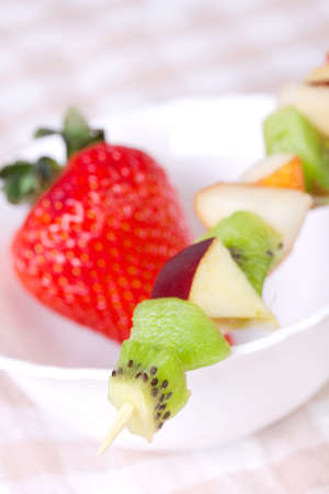 Fruit shashlik on white plate, closeupの写真素材
