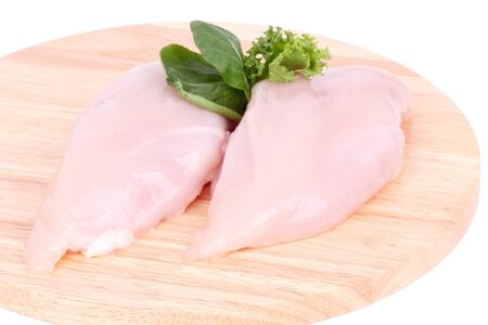 Raw  chicken breast fillet on wooden cutting board, closeupの写真素材
