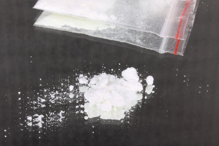Cocaine in packet, closeup on mirror