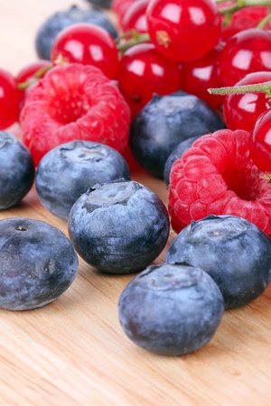 Berries on wooden boardの写真素材