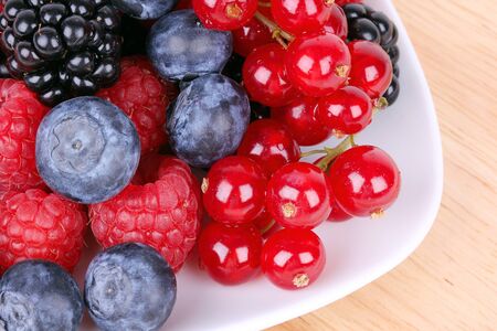 Berries dessert on white plate, closeupの写真素材