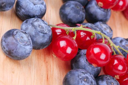 Berries on wooden boardの写真素材