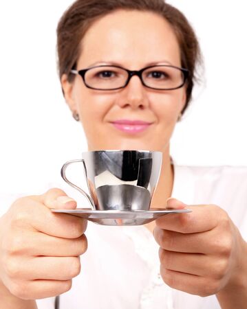 Smiling woman with cup of coffee in hands, closed-up portrait on whiteの写真素材
